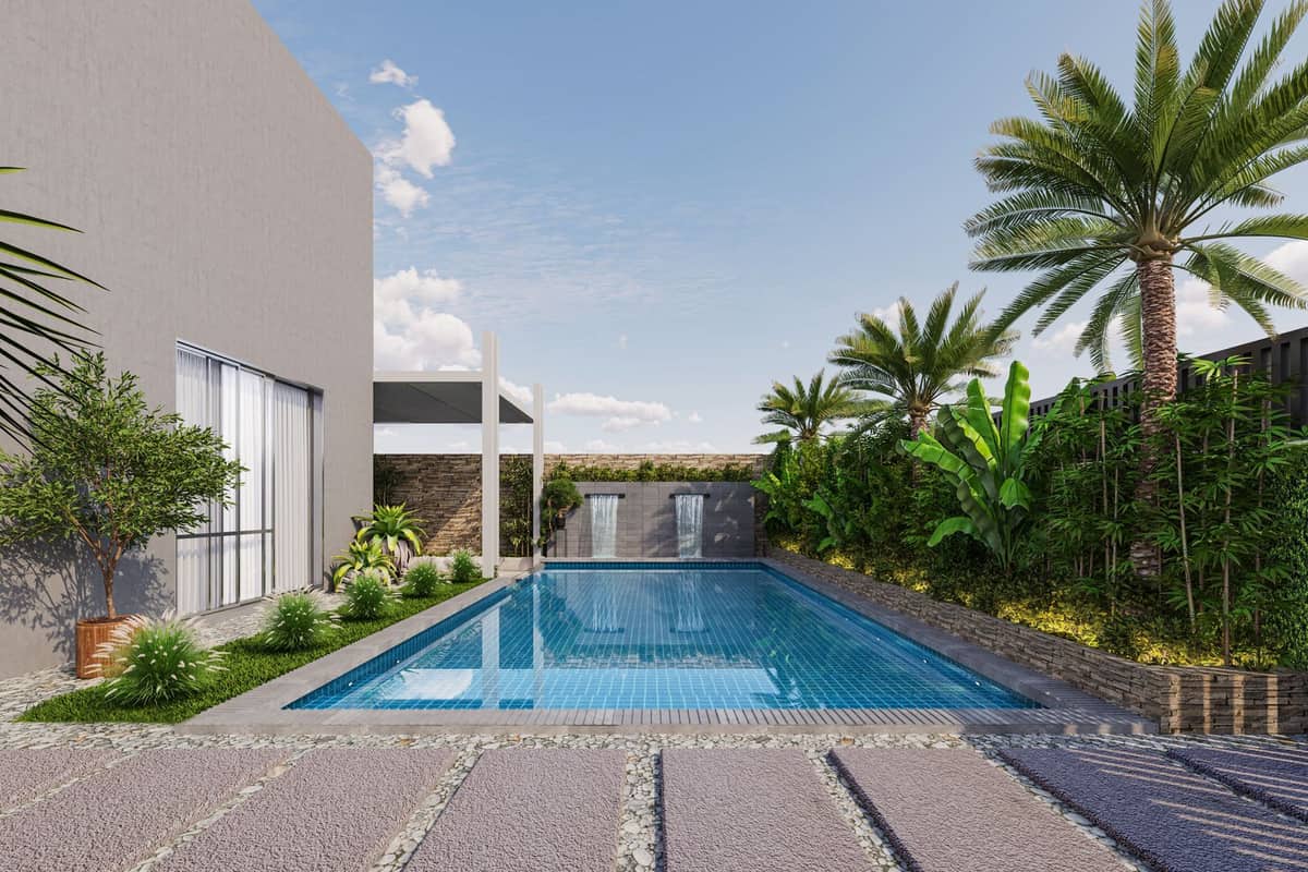 Rebuilt villa garden in Emirates Hills with a rectangular tiled pool, lawn and planted borders