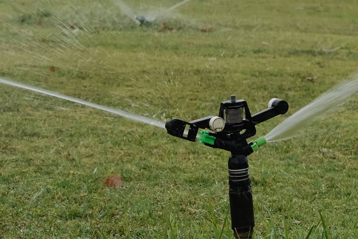 Sprinkler running on a villa lawn at Jumeirah Golf Estates after the irrigation system was replaced